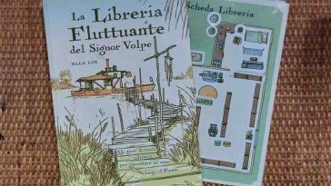 la libreria fluttuante del signor volpe gdr copertina fiume con barca e canne bucoliche