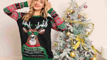 ragazza con maglione di Natale e albero di Natale